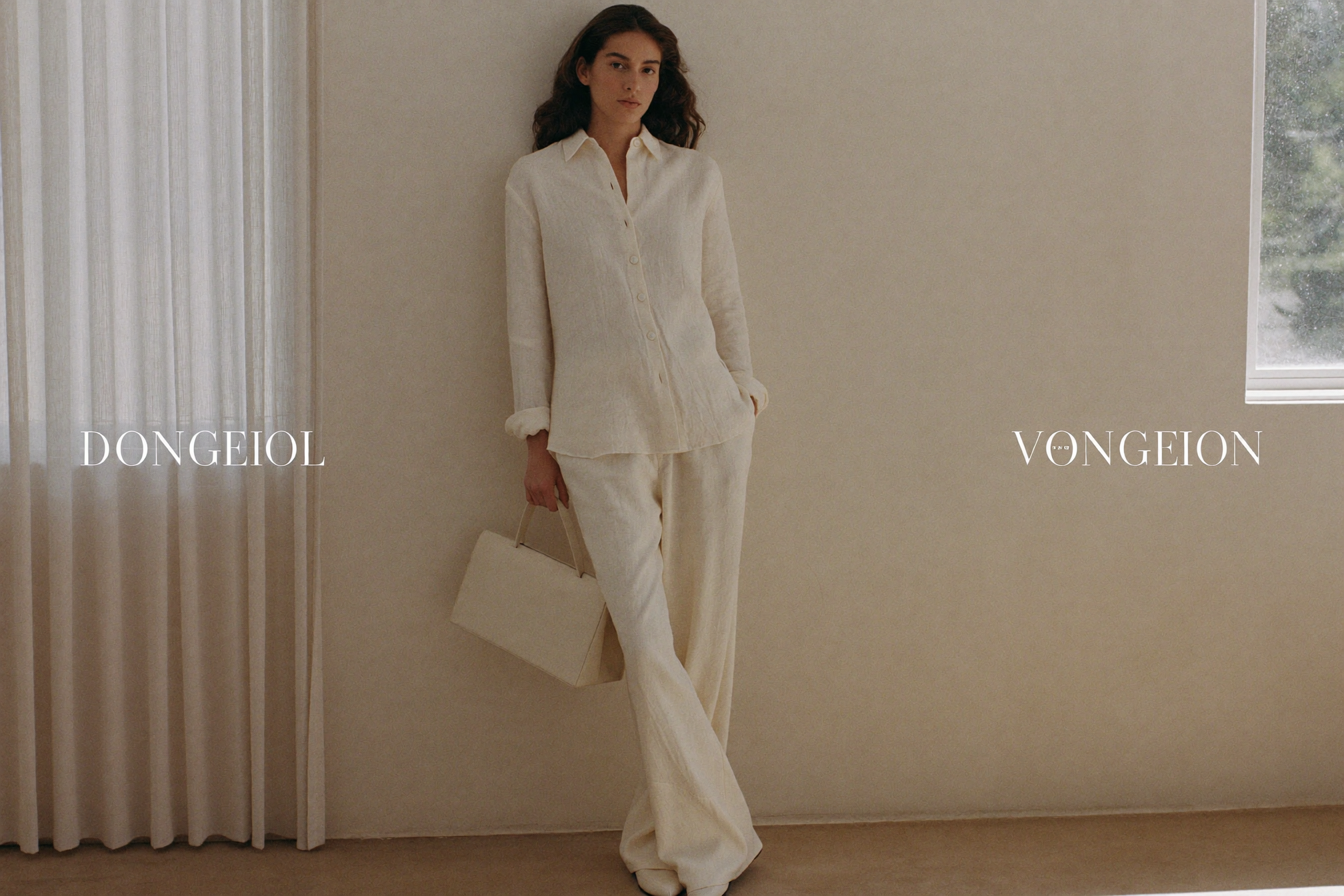 Arlisse campaign, woman in oat-cream linen in a warm sunlit interior